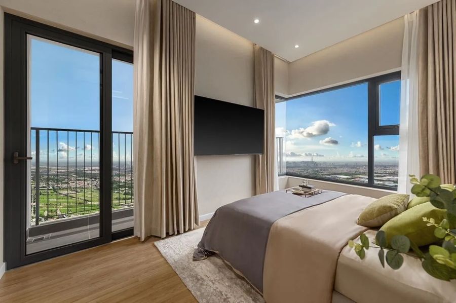 Elysian bedroom with corner windows and a city view towards the Ho Chi Minh City skyline