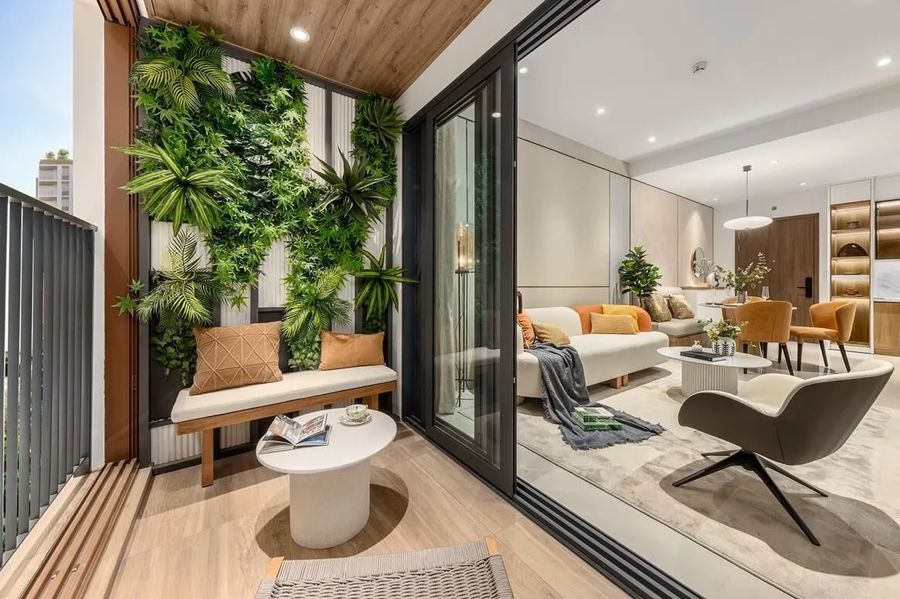 Elysian apartment loggia with a green wall, bench seating and sliding doors onto the living room